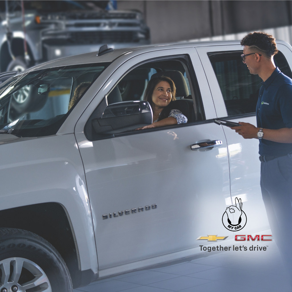 Customer discussing a negative equity vehicle trade-in at a Chevrolet GMC dealership in Central Pennsylvania